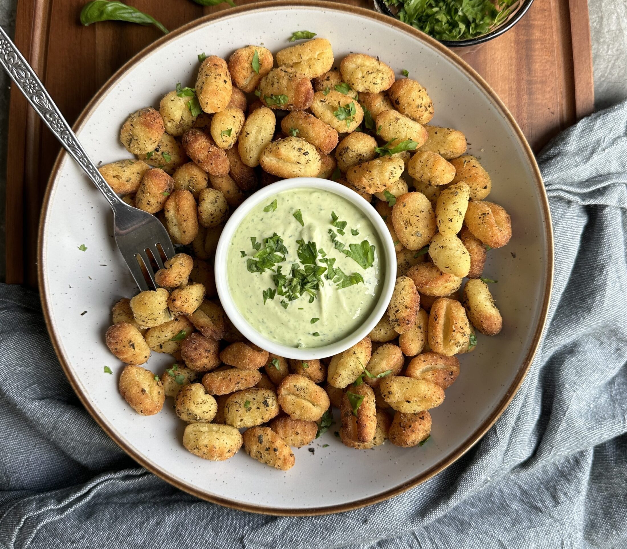 Crispy air fried gnocchi coated with italian seasoning. served with a vegan basil mayo dip
