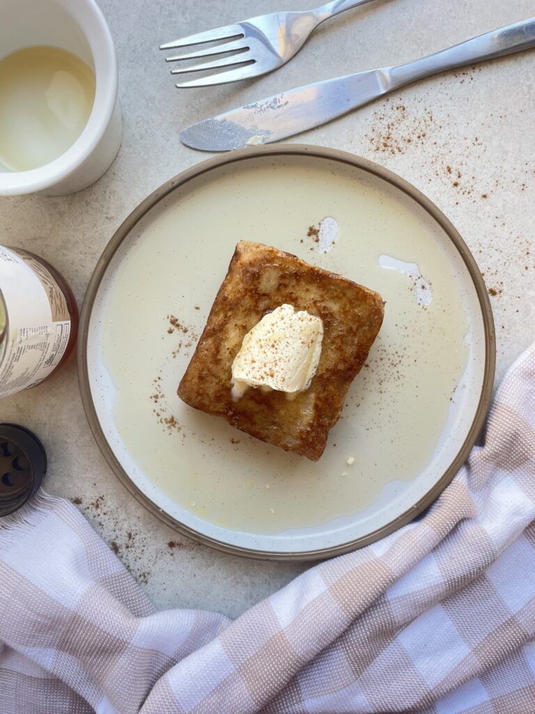 Peanut butter layered bread slices fried to golden perfection in a sweet cinnamon batter topped with butter and syrup