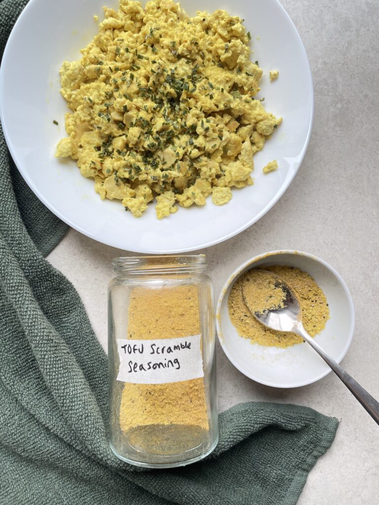 Final image of the tofu scramble seasoning with the finished tofu scramble pictured too