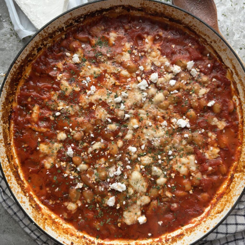 Giant butter beans roasted in a greek style tomato sauce topped with vegan feta and oregano