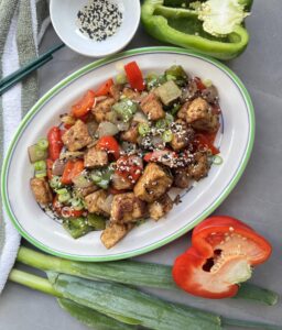 Tofu pieces, red and green bell peppers coated in a Chinese style salt and pepper seasoning