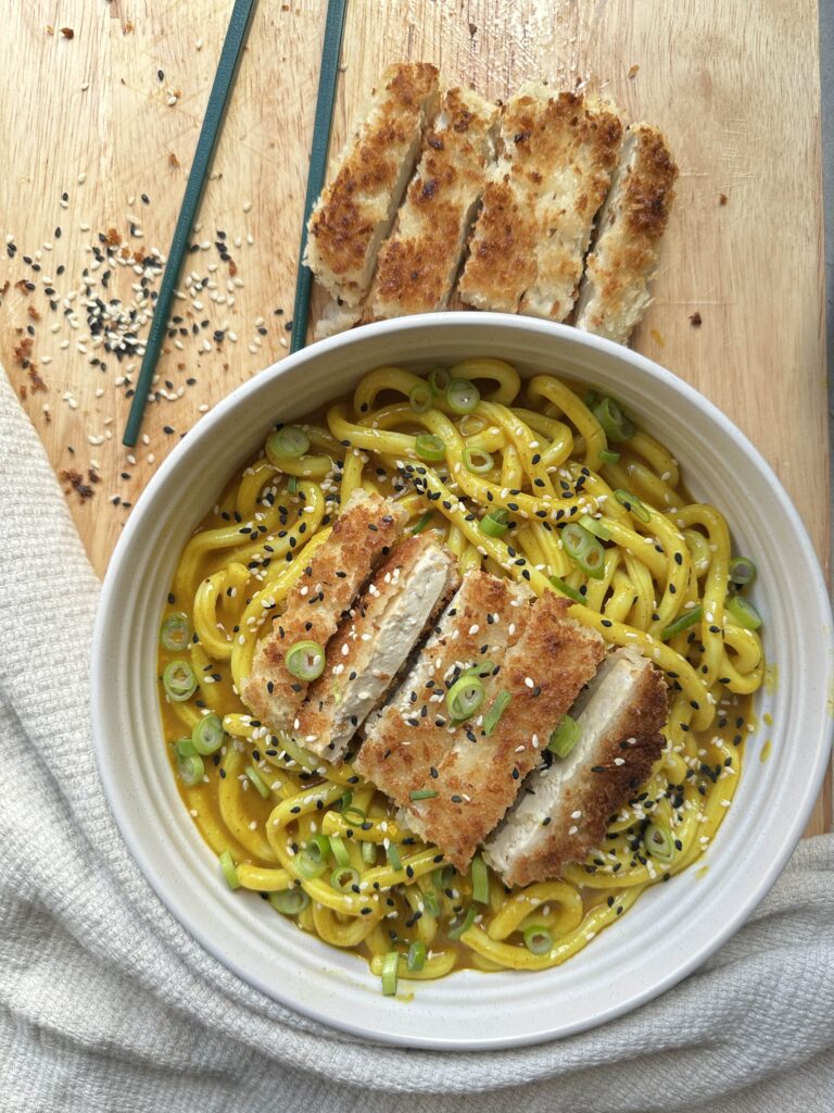 the main image for tofu katsu udon noodles. Curry noodles with a tofu cutlet on top