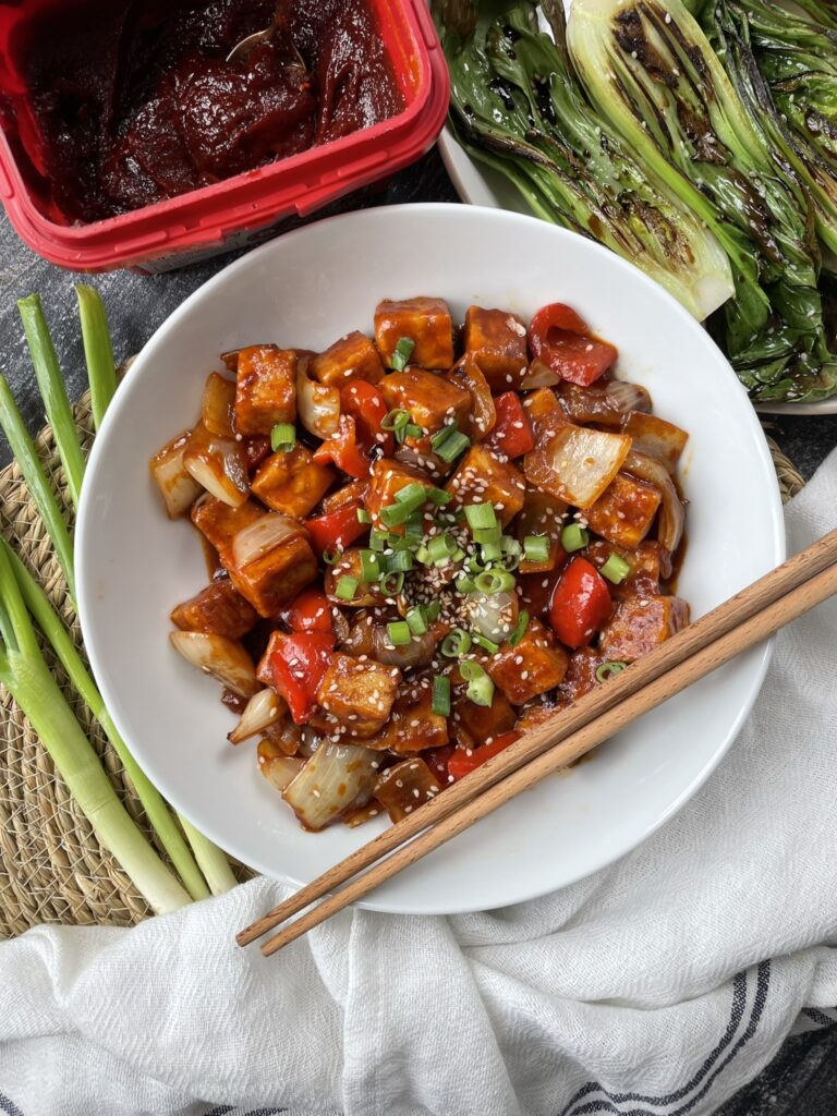 Tempeh cooked in a sticky and spicy gochujang glaze. Cooked with capsicum and onions topped with spring onions