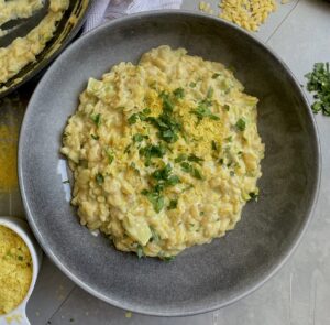 A one pot dish of orzo cooked in a creamy, cheesy sauce with broccoli