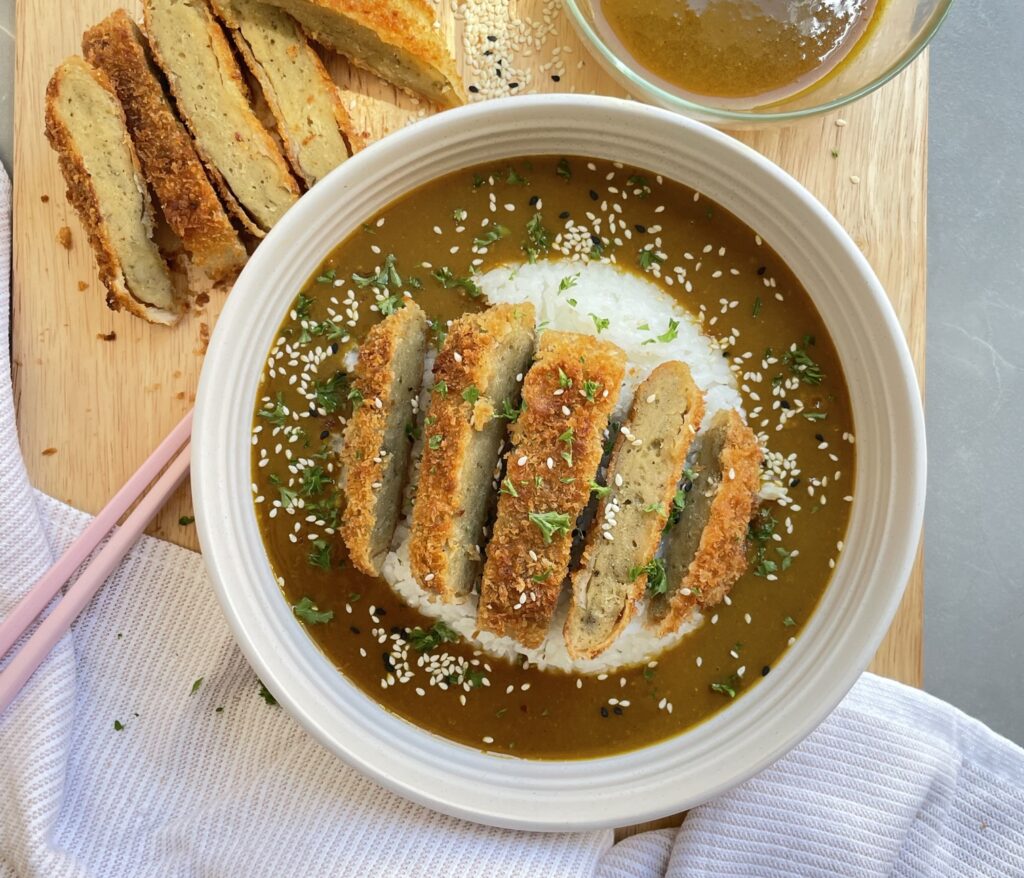 Golden, crispy bread crumbed seitan cutlet with a rich, sweet Japanese curry sauce
