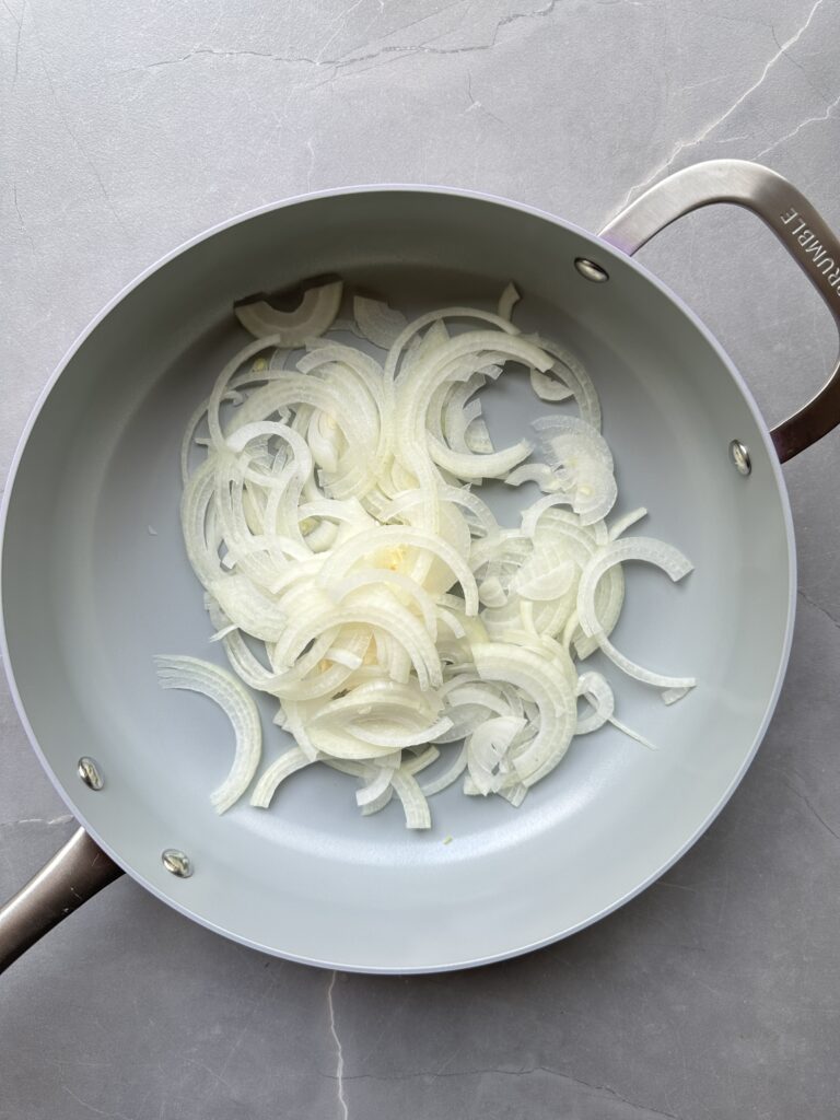 step five of cooking courgette orzo, cook the onions