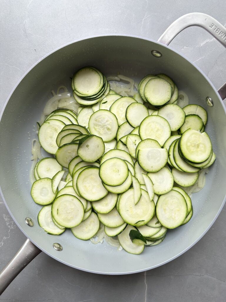 step six of cooking courgette orzo, add the courgettes